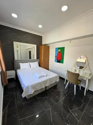 a bedroom with a bed and a desk and a mirror at beyzade palace in Istanbul