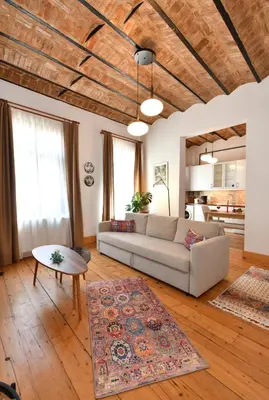 a living room with a couch and a table at Charming Flat Retro Design AC Galata in Istanbul