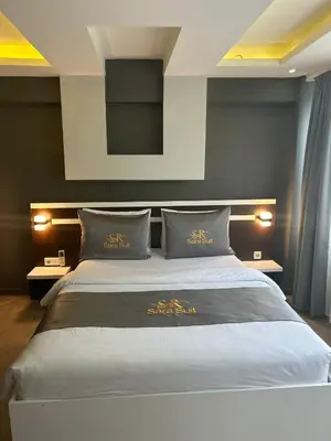 a bedroom with a large bed with two pillows at Sara Suit in Istanbul