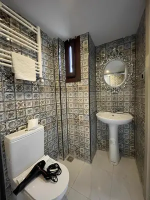 a bathroom with a toilet and a sink at The Lumina Hotel in Istanbul