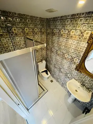 a bathroom with a sink and a toilet at The Lumina Hotel in Istanbul