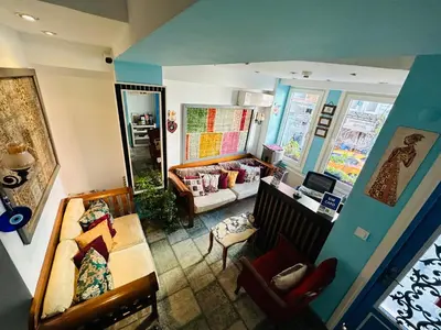 a living room with a couch and a table at LA MAİSON FAMILY Hotel in Istanbul