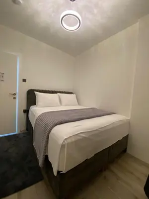 a bedroom with a large bed with a ceiling at Apartment - Little Hagia Sophia in Istanbul