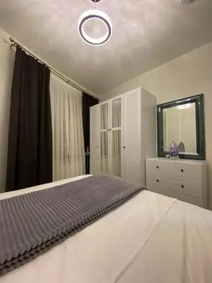 a bedroom with a bed and a dresser and a mirror at Apartment - Little Hagia Sophia in Istanbul
