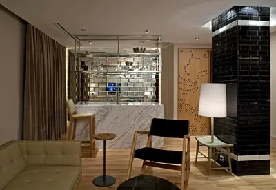 a living room with a couch and a table and chairs at Witt Istanbul Suites in Istanbul