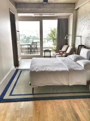 a bedroom with a large bed and a balcony at Witt Istanbul Suites in Istanbul