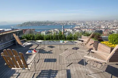 a group of chairs and tables on a roof at Witt Istanbul Suites in Istanbul