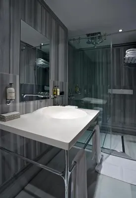 a bathroom with a white sink and a shower at Witt Istanbul Suites in Istanbul