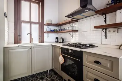 a kitchen with a stove and a sink at Chic 2BR Retreat House - Heart of Cihangir! #394 in Istanbul