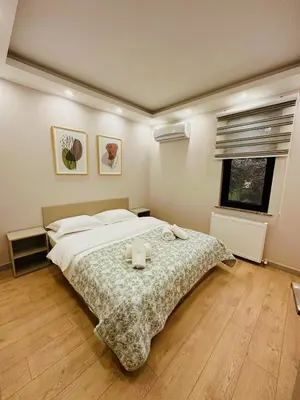 a bedroom with a large bed and a window at Villa Casa Bianca in Sapanca