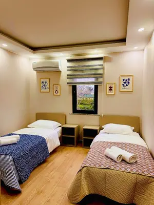 a bedroom with two beds and a window at Villa Casa Bianca in Sapanca