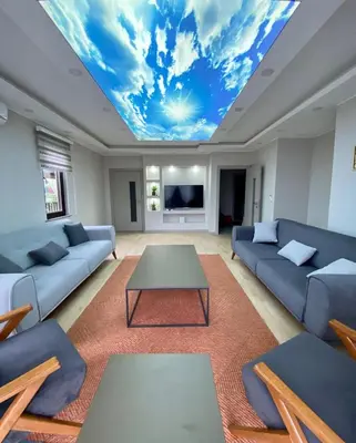 a living room with a ceiling with a sky at Villa Casa Bianca in Sapanca