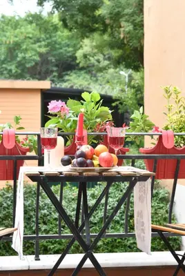 a table with fruit and wine glasses on it at Private Terrace AC Bright Flat Galata in Istanbul