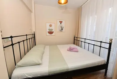 a bedroom with a bed with a pink hat on it at Comfortable Bright Home AC Galata in Istanbul