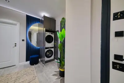 a laundry room with a washer and dryer at Taksim Square 1 plus 1 fully equipped air conditioned luxury apartment in Istanbul