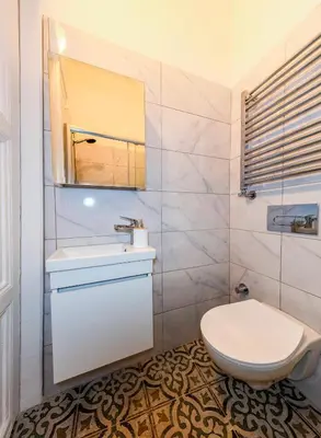 a bathroom with a white toilet and a sink at The Heaven on Heritage Street in Istanbul