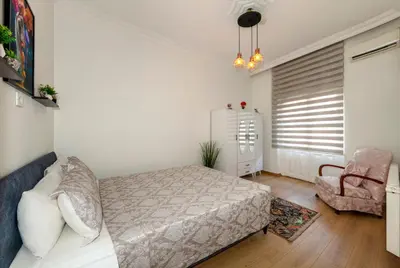 a bedroom with a bed and a chair at The Heaven on Heritage Street in Istanbul