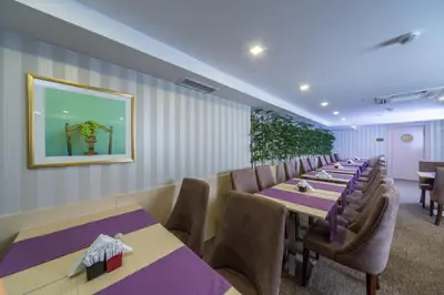 a row of tables and chairs in a restaurant at Molton Monapart Mecidiyekoy in Istanbul
