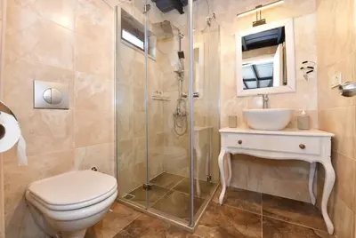 a bathroom with a toilet and a sink and a shower at Cute Flat Vintage Design AC Galata in Istanbul