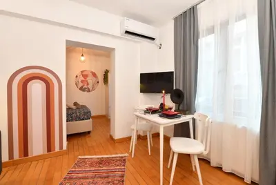 a small room with a table and a bed at Cute Flat Vintage Design AC Galata in Istanbul