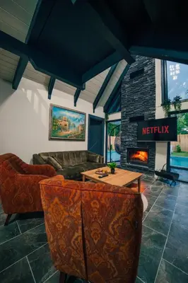 a living room with a couch and a fireplace at MoonSA Boutique Villas in Sapanca