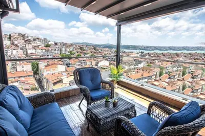 a living room with a view of a city at Hotel Bosfora in Istanbul