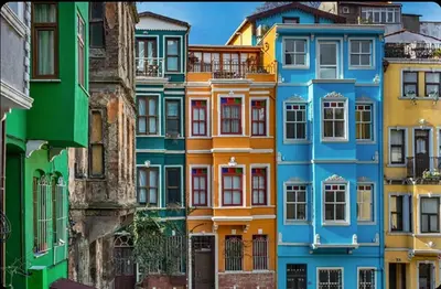 a row of colorful houses in a city at Mercan Apartments Balat-The Bay in Istanbul