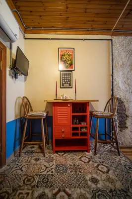 a room with a red desk and two chairs at Mercan Apartments Balat-The Bay in Istanbul