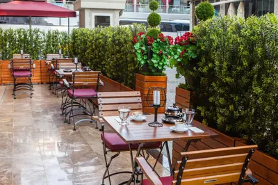 a row of tables and chairs on a patio at Ferman Hilal Hotel-Special Category in Istanbul