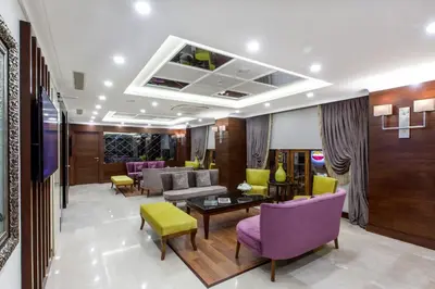 a lobby with purple and yellow chairs and a waiting room at Ferman Hilal Hotel-Special Category in Istanbul