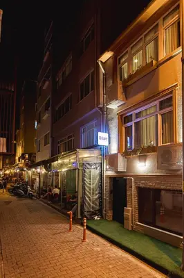 a city street at night with a building at Tare Suites Beşiktaş in Istanbul