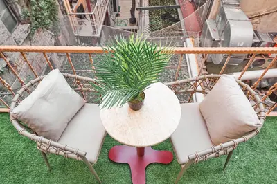 a table and two chairs and a plant on a table at Tare Suites Beşiktaş in Istanbul