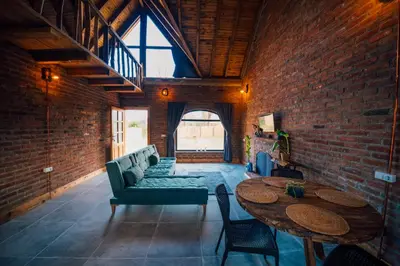 a living room with a couch and a table at oasis sapanca in Sapanca