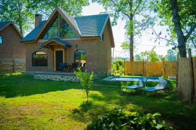 a brick house with a pool in the yard at oasis sapanca in Sapanca