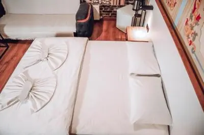 a white couch sitting in a living room at Pablo suit otel in Istanbul