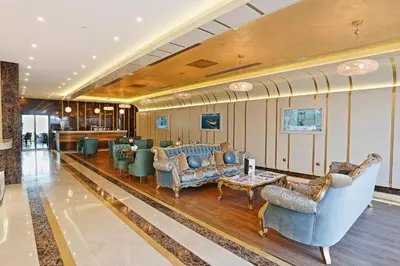 a lobby with couches and chairs and a bar at The Grand Mira Business Hotel in Istanbul