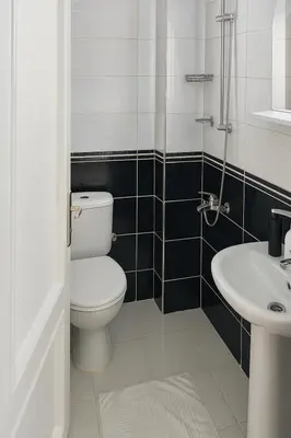 a bathroom with a toilet and a sink at Istanberry - Joker Two Bedroom Apartments in Istanbul