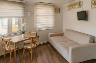 a living room with a couch and a table at Istanberry - Joker Two Bedroom Apartments in Istanbul