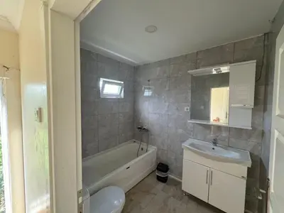 a bathroom with a tub and a sink and a toilet at Sapanca Bizim Konak in Sapanca
