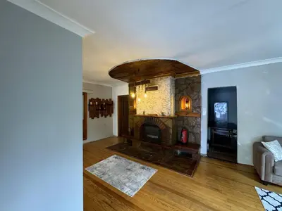 a living room with a fireplace and a couch at Sapanca Bizim Konak in Sapanca
