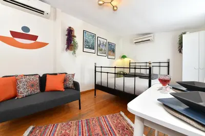a living room with a couch and a bed at Cute Home Balcony Retro Design AC Galata in Istanbul
