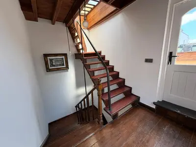 a spiral staircase in a room with a door at Galata Tower Suites in Istanbul