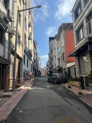 an empty city street with a car parked on the street at Murat bey konağı in Istanbul