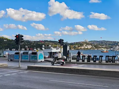 a person on a scooter at a gas station near the water at Equipped Flat w Balcony - In The Arnavutköy - Bebek in Istanbul
