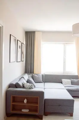 a living room with a couch and a window at Luxe Suite AI28 in Esenyurt