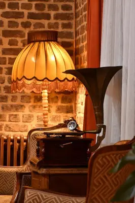 a lamp sitting on top of a table with a suitcase at Turkish Hammam 3 BR Historical Flat 3 AC in Istanbul