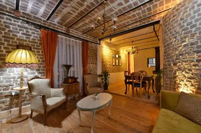 a living room with a table and a dining room at Turkish Hammam 3 BR Historical Flat 3 AC in Istanbul