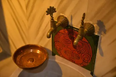 a gold toilet sitting on top of a table at Turkish Hammam 3 BR Historical Flat 3 AC in Istanbul