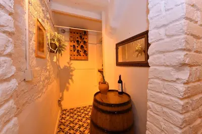 a room with a barrel and a bottle of wine at Turkish Hammam 3 BR Historical Flat 3 AC in Istanbul