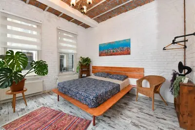 a bedroom with a bed and a chair in it at 2BR Unique Terrace 2 AC in Beyoğlu Galata in Istanbul